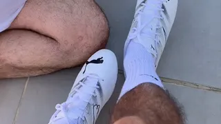 the slave makes himself useful by cleaning my cleats with his tongue and then getting trampled