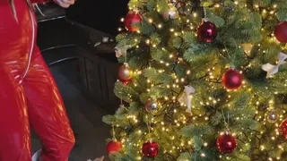 Christmas tree decorating in red, hot jumpsuit with Hunterboots