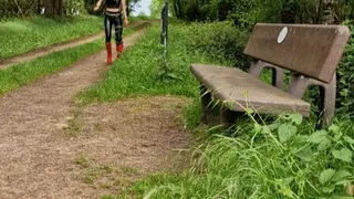 Hot Girl with red Hunter and Latexleggings at the Forrest with Kneeorthesis