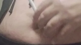 Playing with my belly button while smoke