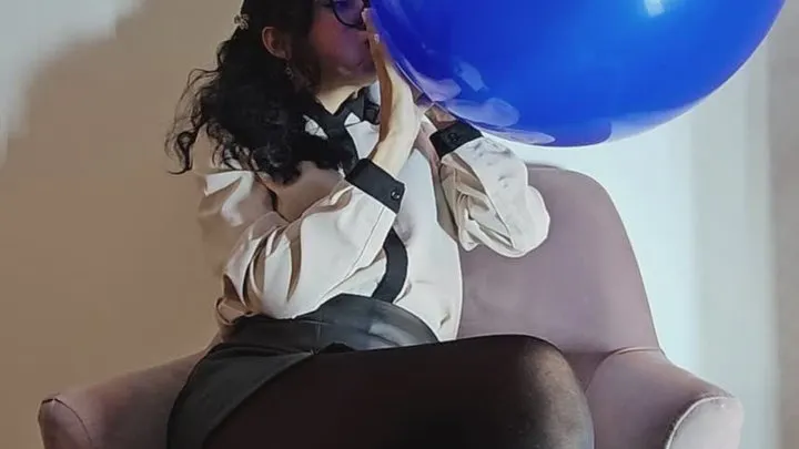 Marianna rides her beautiful blue king balloon in the armchair