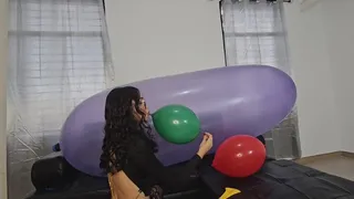 Marianna tries to pop balloons on top of her large GL 1200 balloon