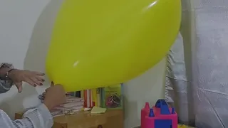 Marianna tries to inflate her square balloon without bursting it