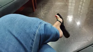 Legs crossed and flip-flops dangling from the feet (1)