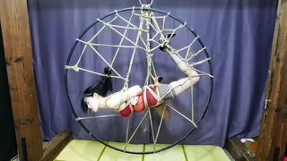 Brave girl challenges 2 types of suspension, then challenges bondage and successfully frees herself