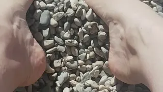 Little rocks between My toes on the beach