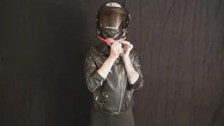 Sophia tries on the right size motorcycle helmet