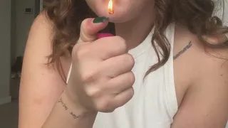 Sexy brunette with big tits smokes