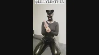 Latex kitty has some fun with her dildo