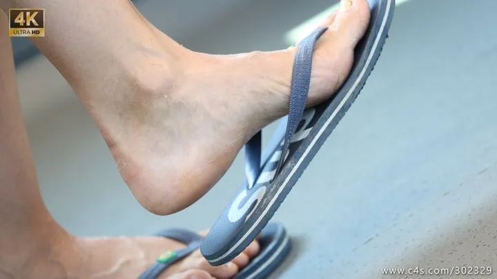 Hot feet with dirty and ruined flip flops, foot and slippers close-up fetish