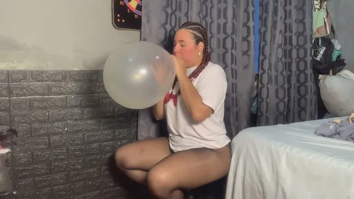 blowing clear glass balloon 26 inches until bursting