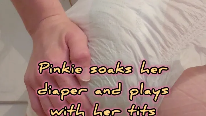 Pinkie soaks her diaper and plays with her tits