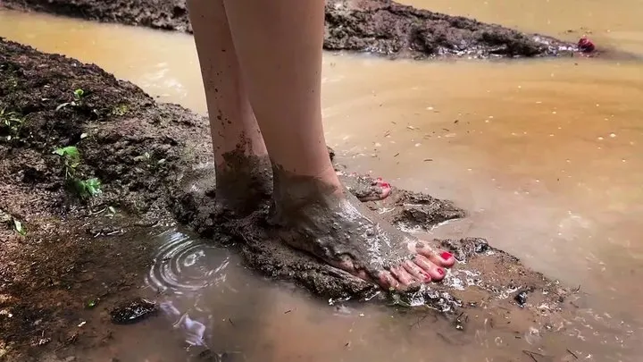 Walking barefoot through deep mud and smelly puddles, barefoot in mud, muddy feet