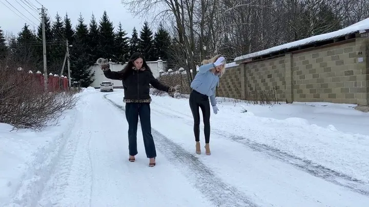 Two girl on high heels mules walking on ice, slippery high heels, girl on high heels on ice