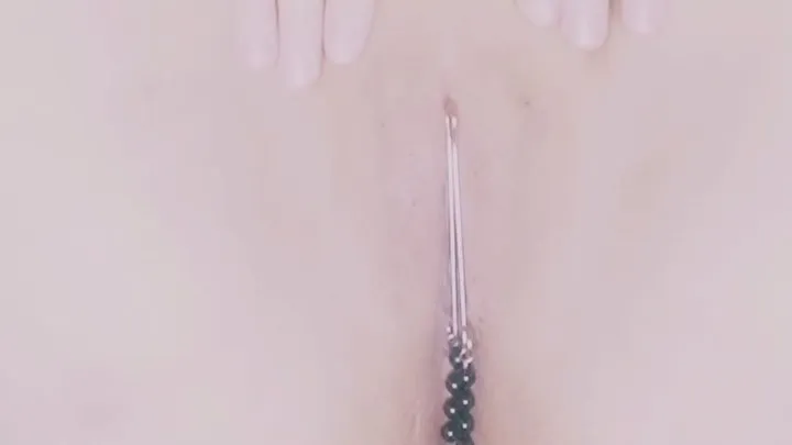 MILF puts on clit jewelery