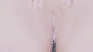 MILF puts on clit jewelery