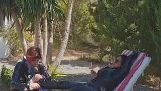 Feet massage under the palm tree