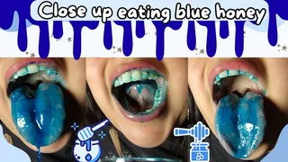 Close up eating blue honey